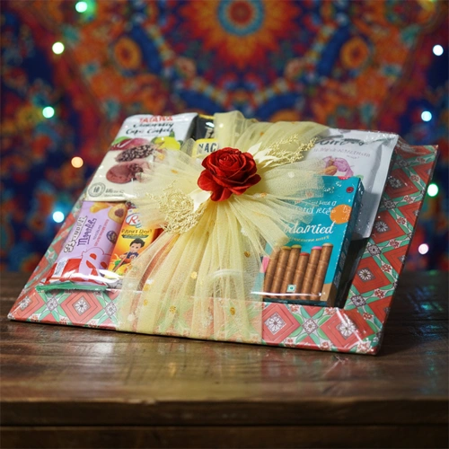 Chocolate confectionery and nuts gift hamper in decorative wooden tray with flowers by Tohfa Riwaz Mohali