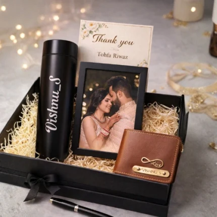 Personalised gift hamper by Tohfa Riwaz with stainless steel water bottle, wallet, pen and photo frame