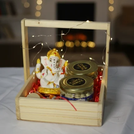 Ganesh Ji statue chocolate and nuts gift hamper with fairy lights in wooden tray by Tohfa Riwaz Mohali