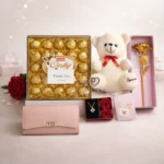 Luxury personalized gift hamper for her with ladies clutch teddy necklace and big chocolate box by Tohfa Riwaz