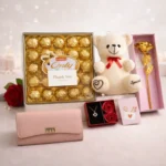 Luxury personalized gift hamper for her with ladies clutch teddy necklace and big chocolate box by Tohfa Riwaz